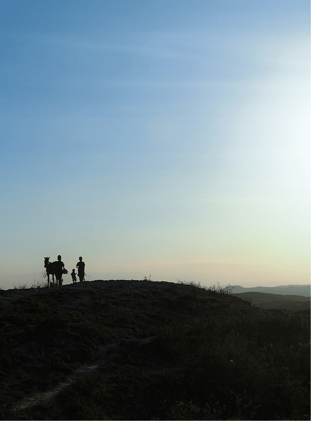 Explorer on horseback in a dramatic landscape